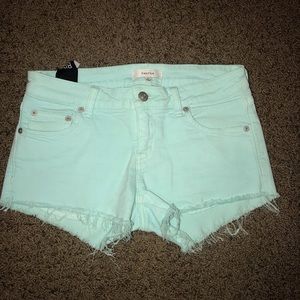 Talula size 27 raw hem teal jean shorts